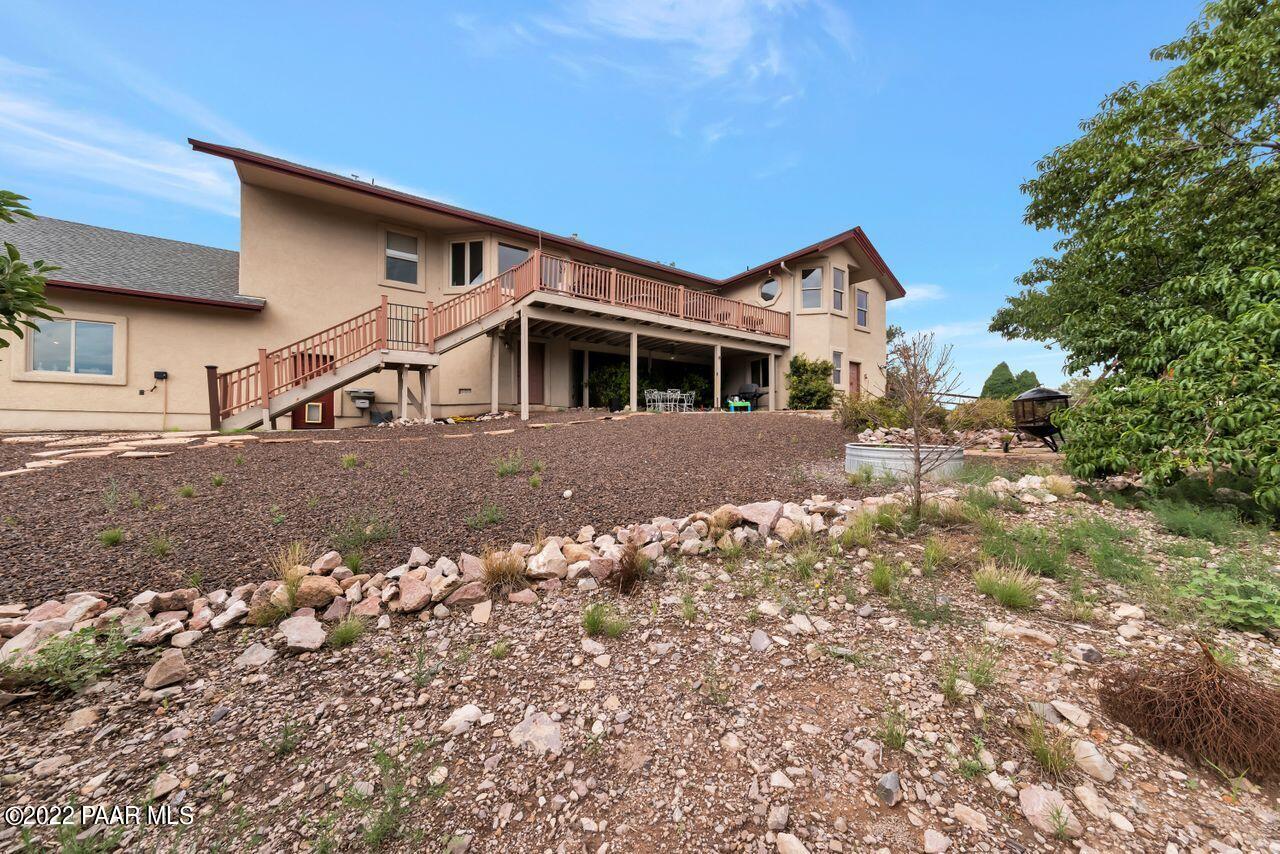 5755 West Rambling Road Prescott, AZ 86305 - Photo 19 of 22 a front view of a house with a yard