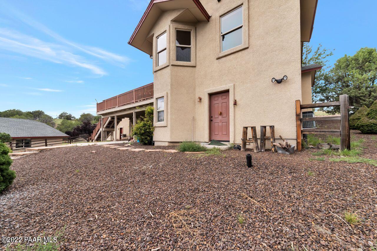 5755 West Rambling Road Prescott, AZ 86305 - Photo 20 of 22 a front view of a house with a yard