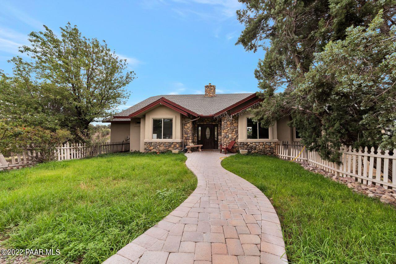5755 West Rambling Road Prescott, AZ 86305 - Photo 2 of 22 a front view of a house with yard and green space