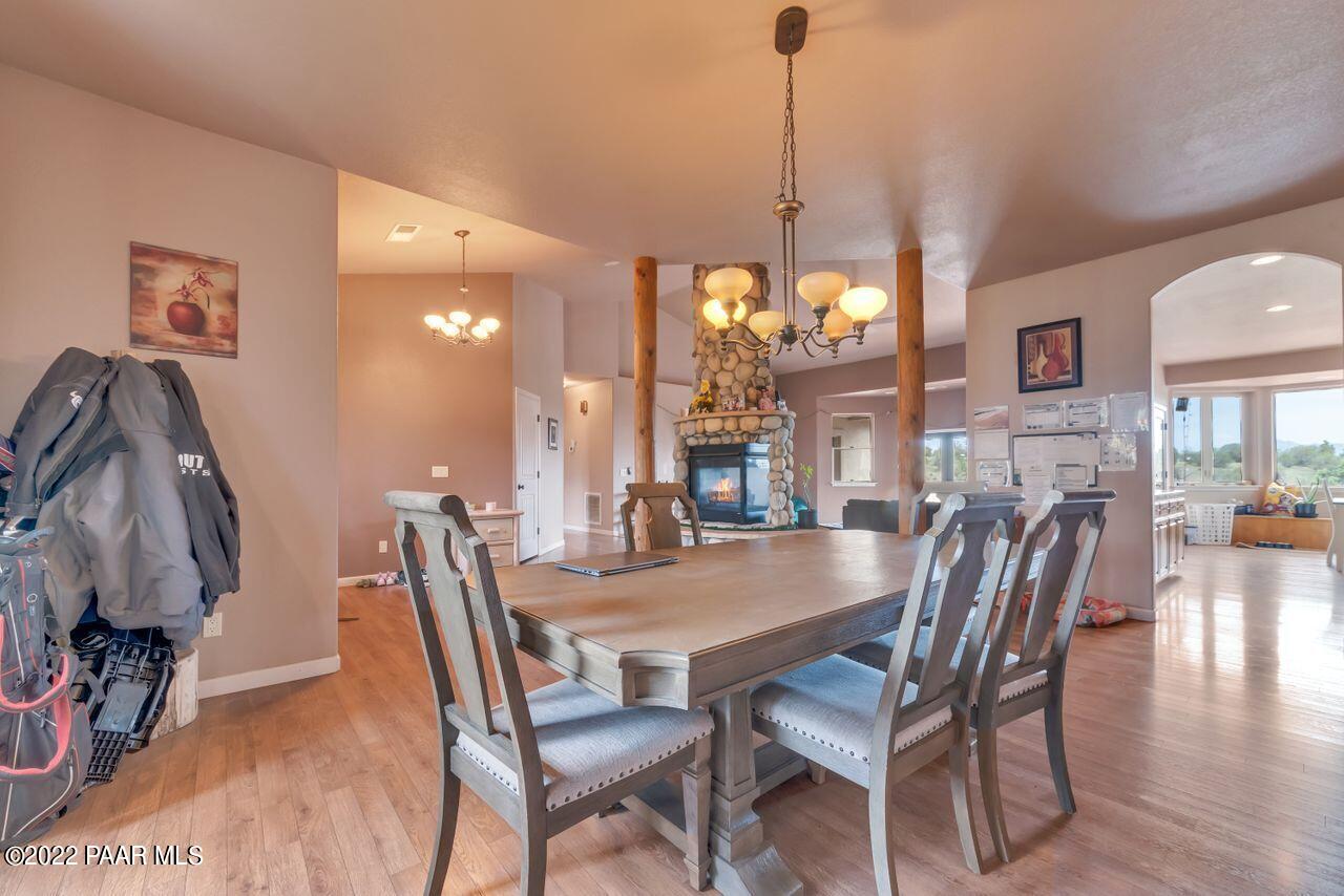 5755 West Rambling Road Prescott, AZ 86305 - Photo 4 of 22 a dining room with furniture and wooden floor