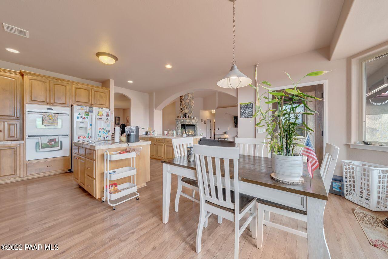 5755 West Rambling Road Prescott, AZ 86305 - Photo 6 of 22 a view of kitchen with furniture and wooden floor