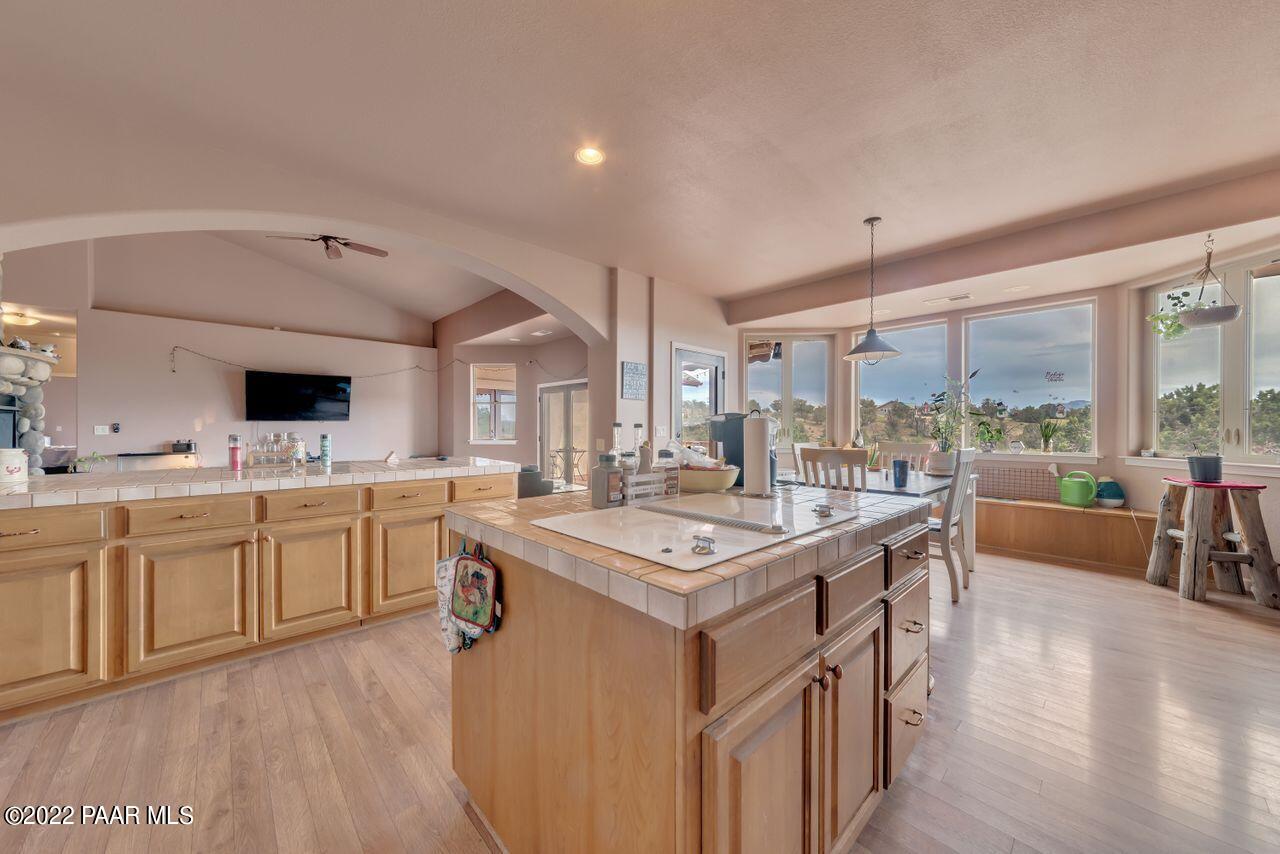 5755 West Rambling Road Prescott, AZ 86305 - Photo 7 of 22 a kitchen with white cabinets sink and stainless steel appliances