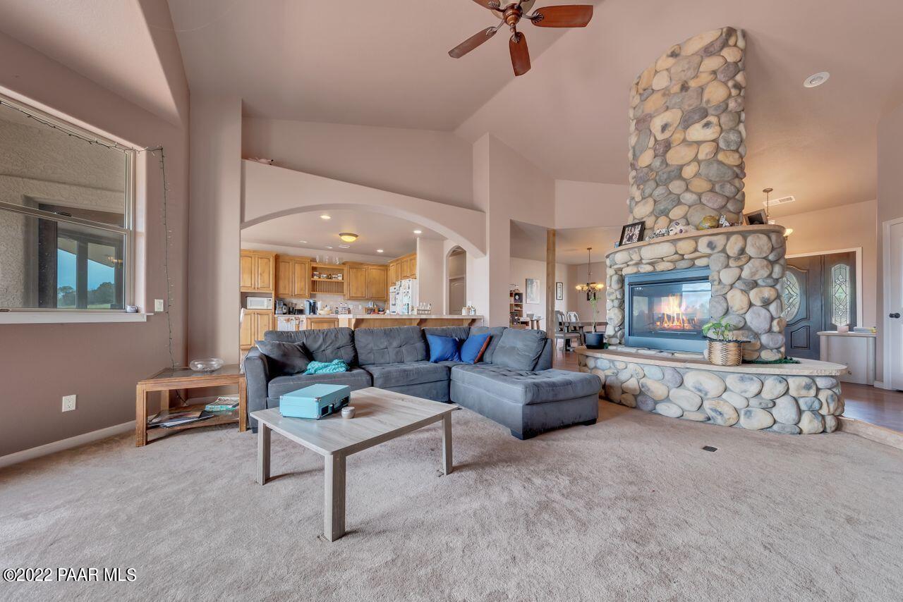 5755 West Rambling Road Prescott, AZ 86305 - Photo 8 of 22 a living room with furniture and a fireplace