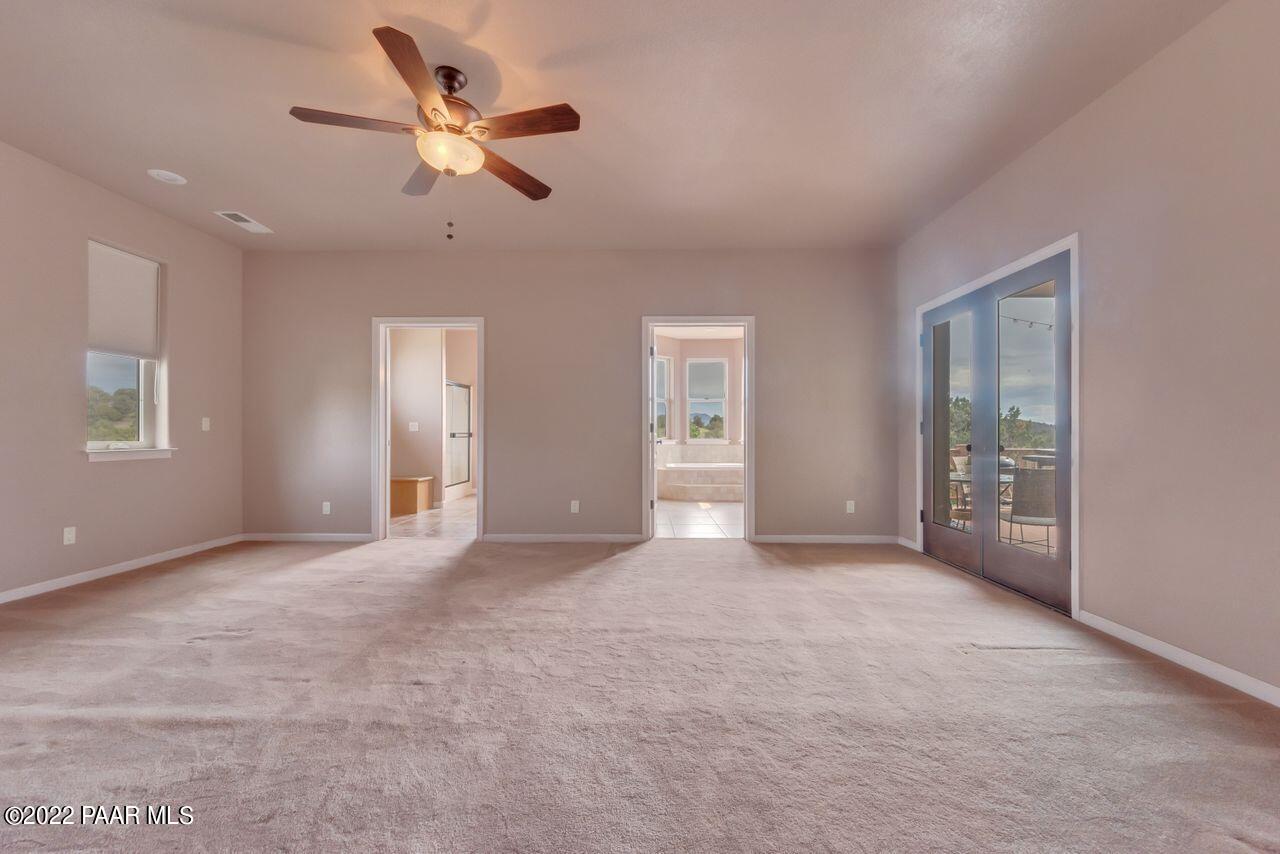 5755 West Rambling Road Prescott, AZ 86305 - Photo 9 of 22 a view of an empty room with a ceiling fan