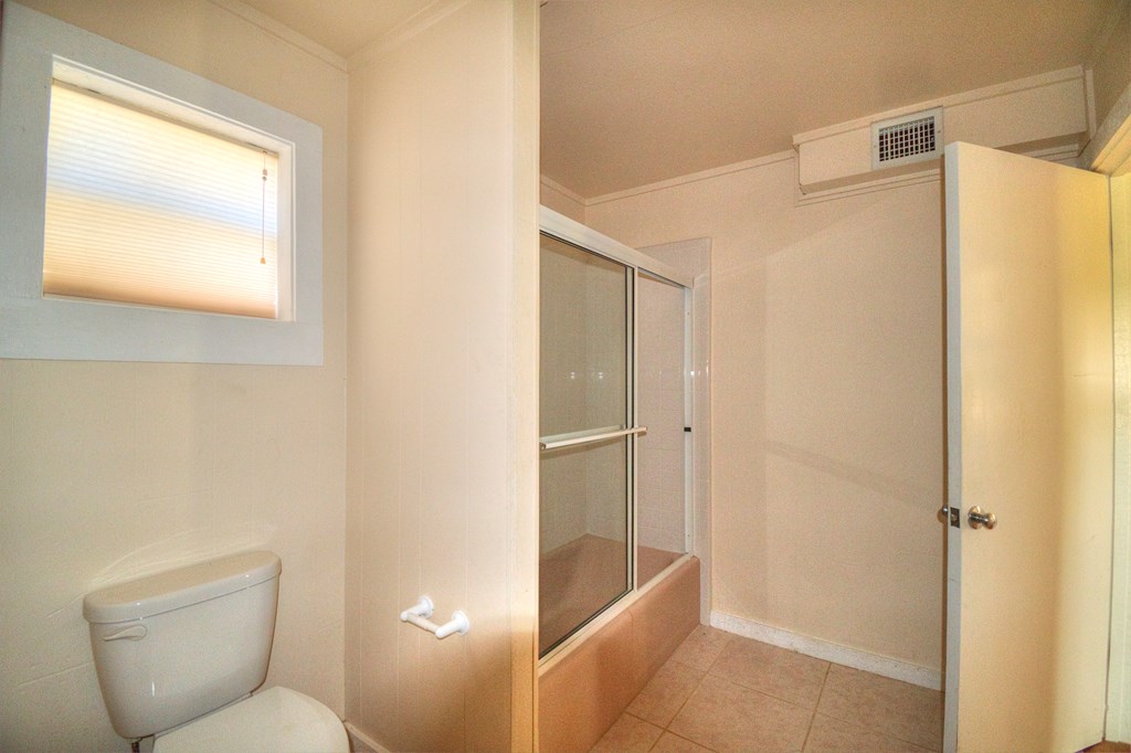 155 A Nimitz Road Kerrville, TX 78028 - Photo 12 of 17 a bathroom with a shower and a toilet
