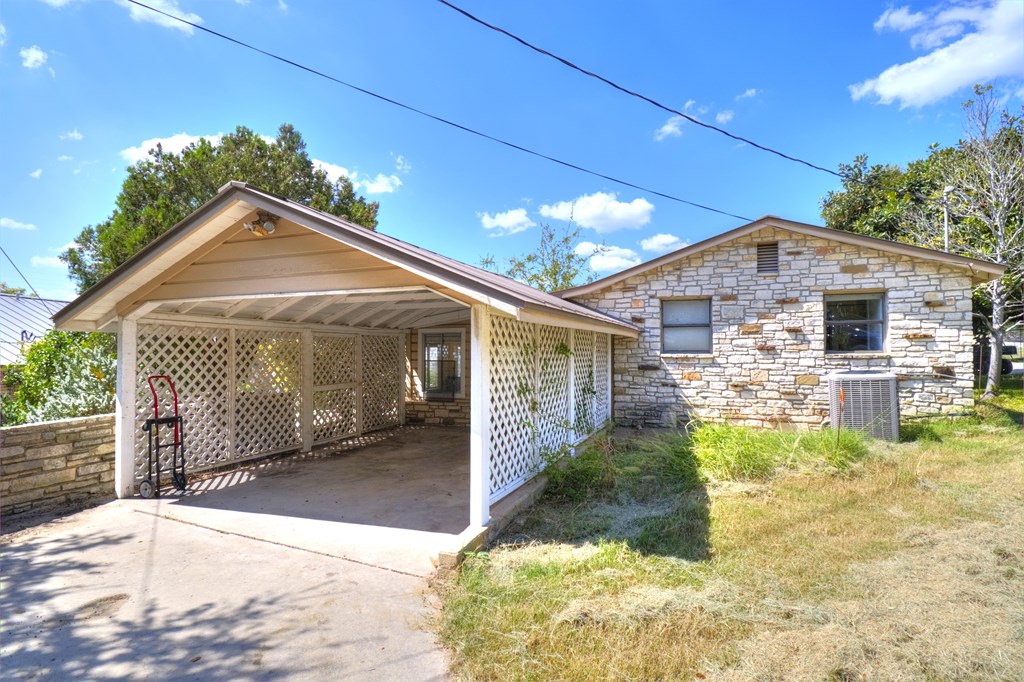 155 A Nimitz Road Kerrville, TX 78028 - Photo 15 of 17 a front view of a house with a yard and garage