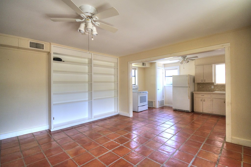 155 A Nimitz Road Kerrville, TX 78028 - Photo 5 of 17 a view of a kitchen with a refrigerator and a stove top oven