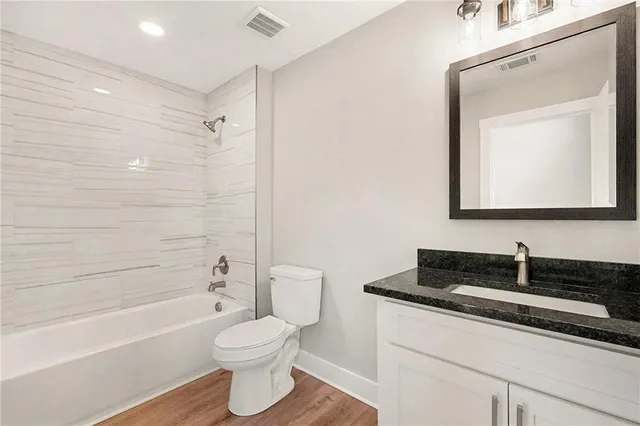 a bathroom with a sink a toilet and a bathtub