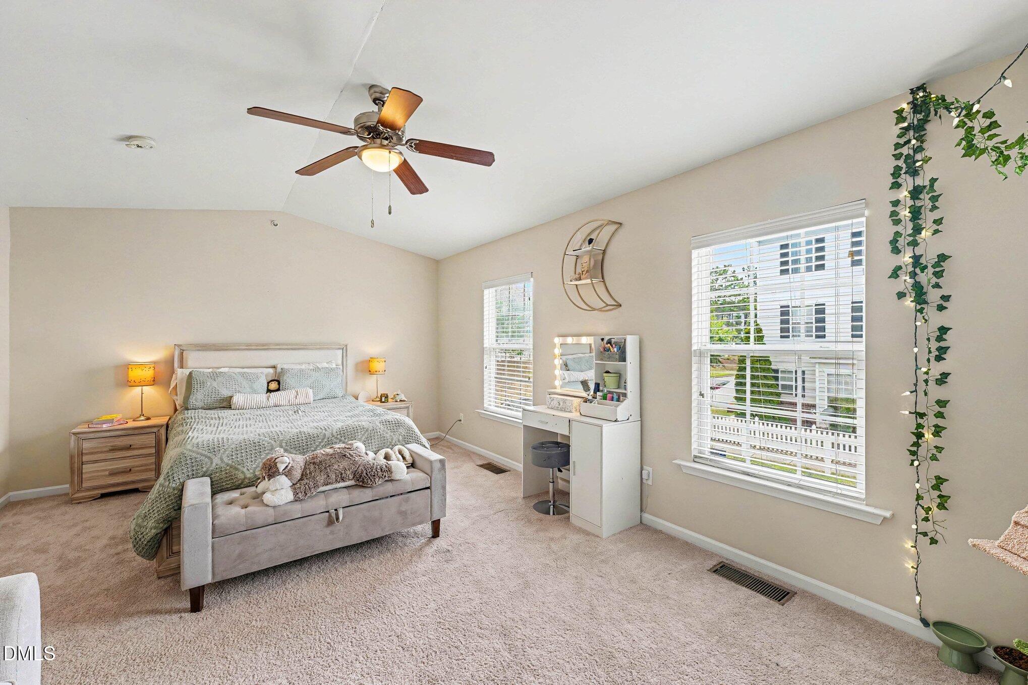 1130 Renewal Place, Unit 106 Raleigh, NC 27603 - Photo 20 of 34 a bedroom with a bed and a window