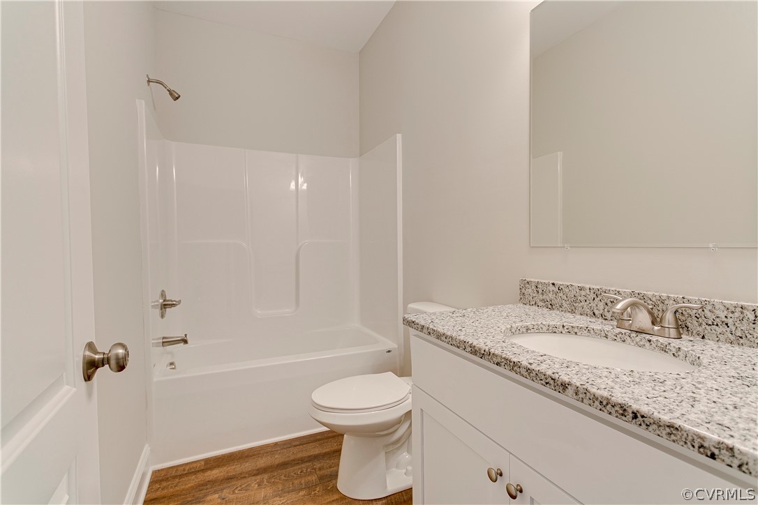 123 Carter Road Cumberland, VA 23040 - Photo 19 of 25 The hall bath offers LVP flooring, custom cabinets, fiberglass tub/shower combo, and vanity lighting.
