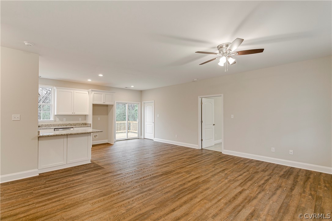 123 Carter Road Cumberland, VA 23040 - Photo 3 of 25 The spacious family room offers LVP flooring, a ceiling fan, and cable connection.