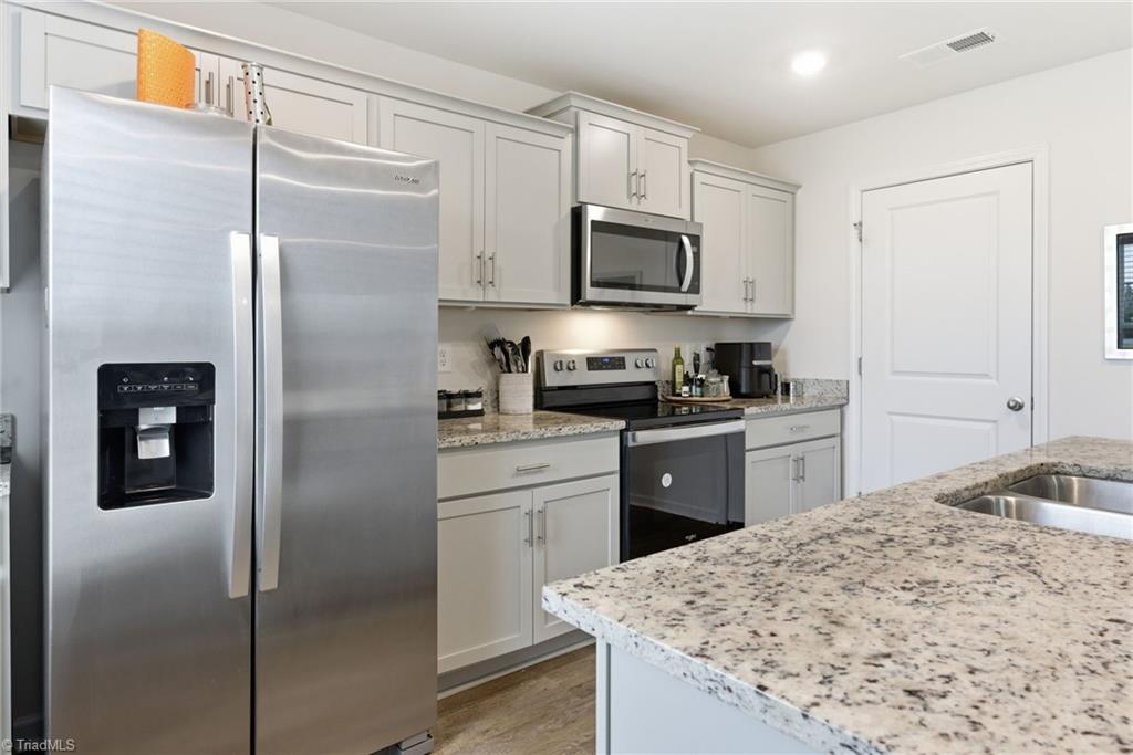 1702 Carter Daniel Drive Graham, NC 27253 - Photo 11 of 35 Kitchen with stainless steel appliances