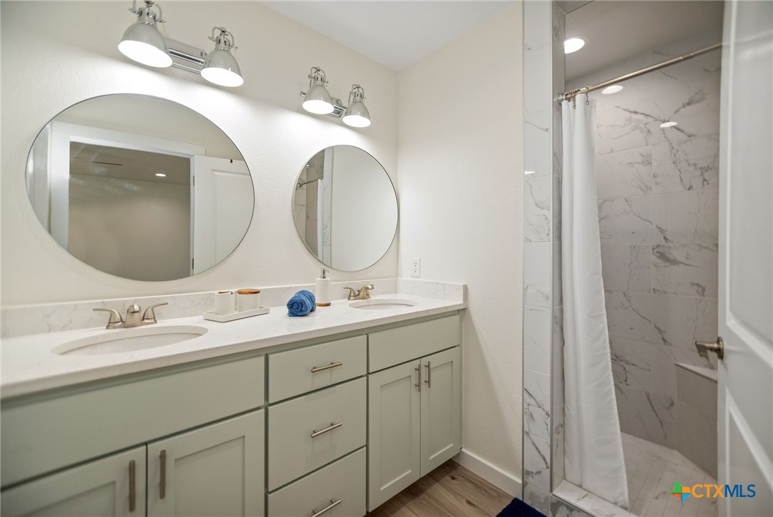 253 Carrie Street Port O'Connor, TX 77982 - Photo 13 of 33 Primary Bathroom with Double Vanity and Shower