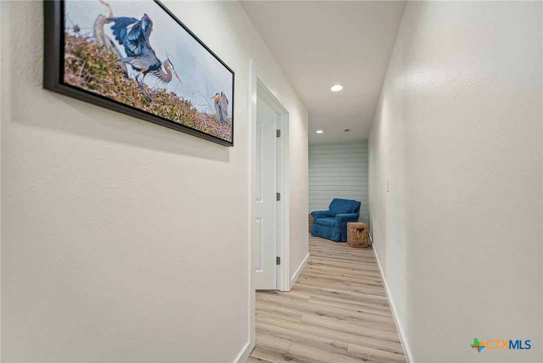 253 Carrie Street Port O'Connor, TX 77982 - Photo 17 of 33 Second Floor Hallway with Sitting/Bonus Space
