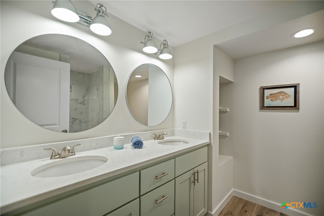 253 Carrie Street Port O'Connor, TX 77982 - Photo 22 of 33 Secondary Bathroom with Double Vanity with Shower