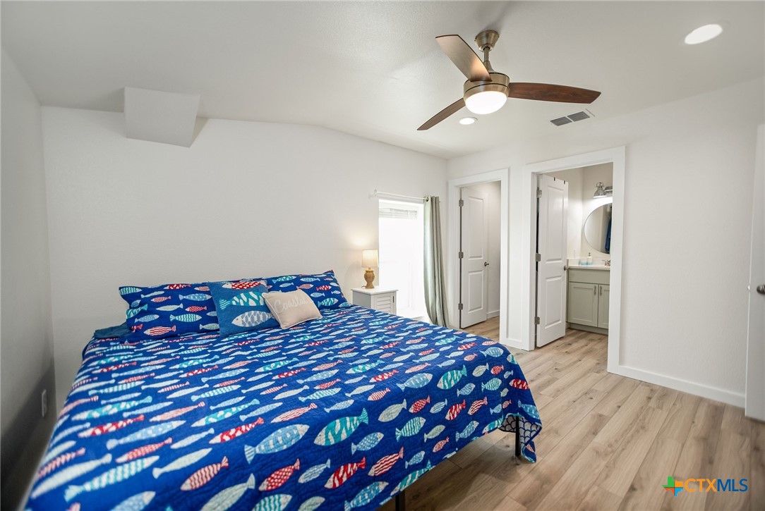 253 Carrie Street Port O'Connor, TX 77982 - Photo 25 of 33 Bedroom with En-Suite Bathroom