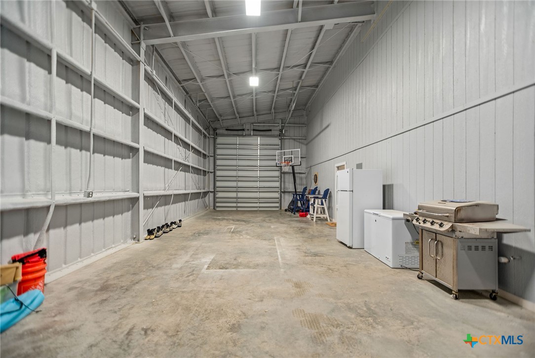 253 Carrie Street Port O'Connor, TX 77982 - Photo 28 of 33 Oversize Garage with 12 x 14 Roll Up Door