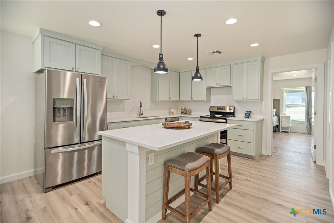 253 Carrie Street Port O'Connor, TX 77982 - Photo 4 of 33 Kitchen with Large Island