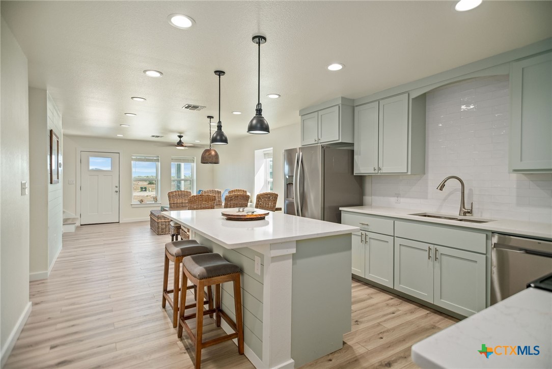 253 Carrie Street Port O'Connor, TX 77982 - Photo 7 of 33 Kitchen Open to the Dining and Living Area