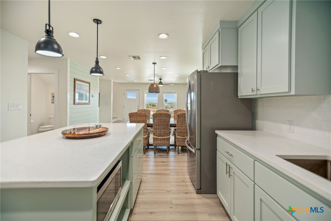 253 Carrie Street Port O'Connor, TX 77982 - Photo 8 of 33 Kitchen Open to the Dining and Living Area