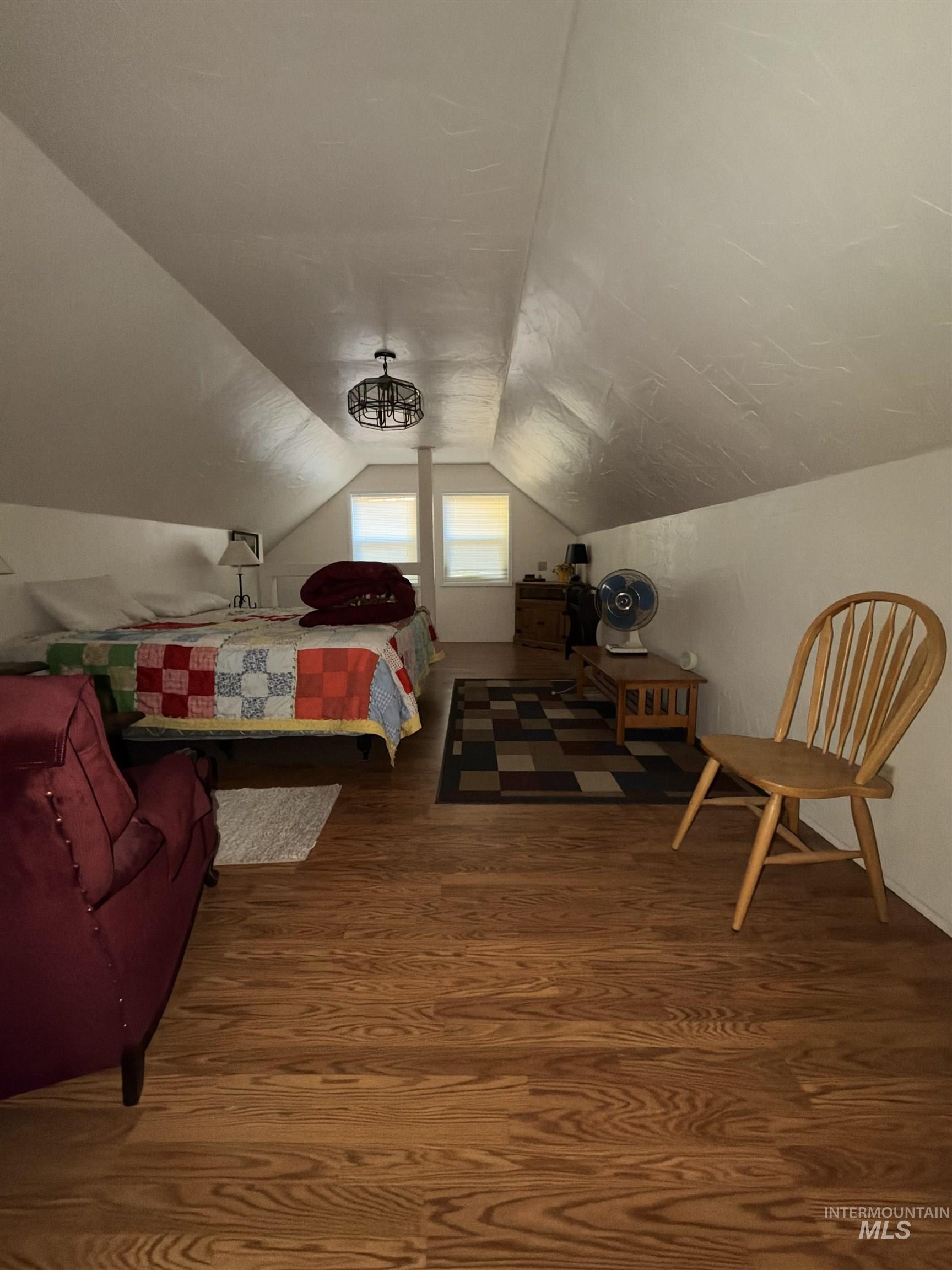 687 Big Cedar Road Kooskia, ID 83539 - Photo 28 of 37 Sloped ceilings with recessed windows, wood-finish flooring, and a contemporary ceiling fixture