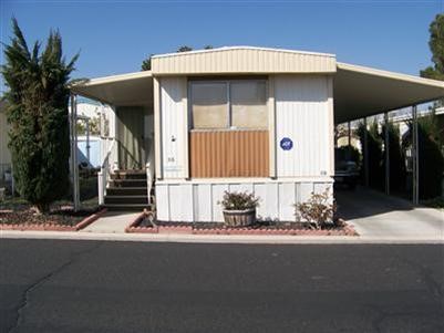 600 East Rimrock Road, Unit 56 Barstow, CA 92311 - Photo 1 of 1 a view of a house with a yard