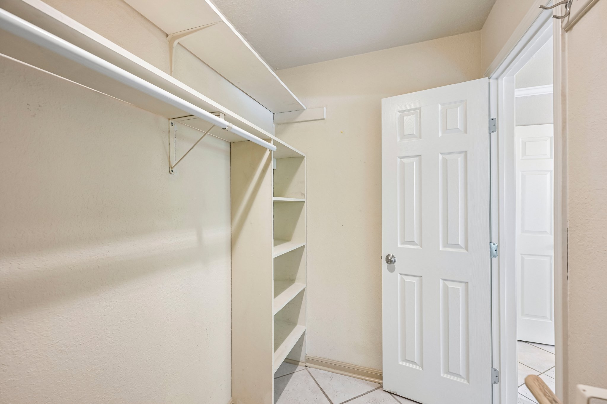 2412 Enfield Road, Unit 8 Austin, TX 78703 - Photo 23 of 34 Storage gets even better from this angle. The walk-in closet gives you shelving, hanging space, and enough room to keep everyday life organized instead of spilling into the bedroom.