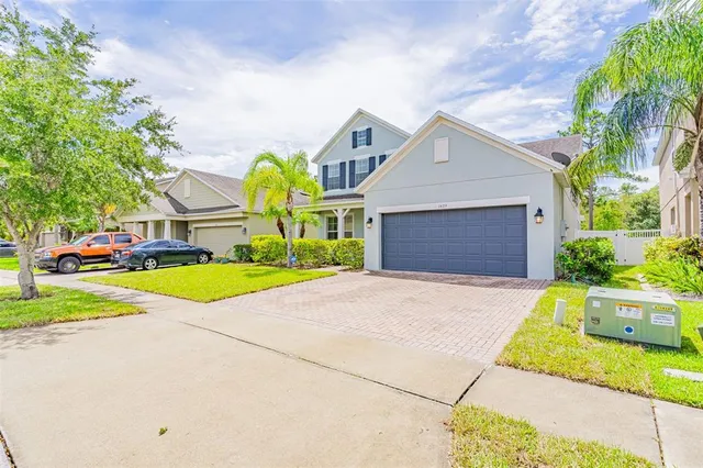 a view of a house with a yard and plants