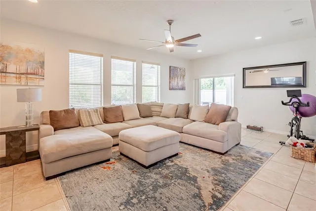 a living room with furniture and windows