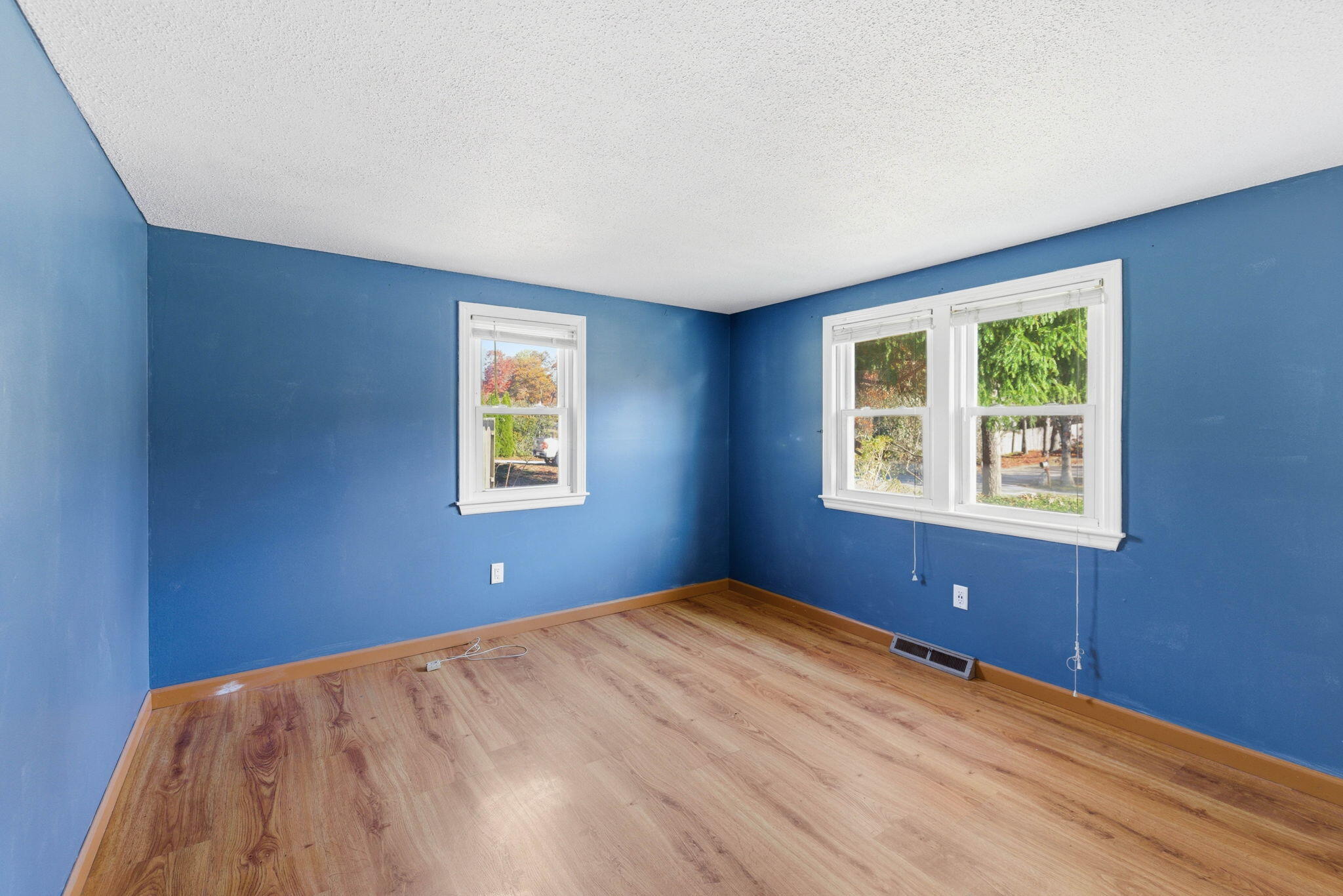 544 Cotuit Road Mashpee, MA 02649 - Photo 18 of 30 a view of a big room with windows and chandelier