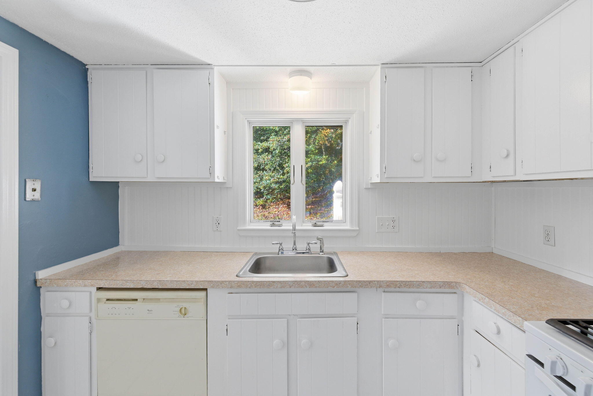 544 Cotuit Road Mashpee, MA 02649 - Photo 9 of 30 a kitchen with appliances cabinets and a sink