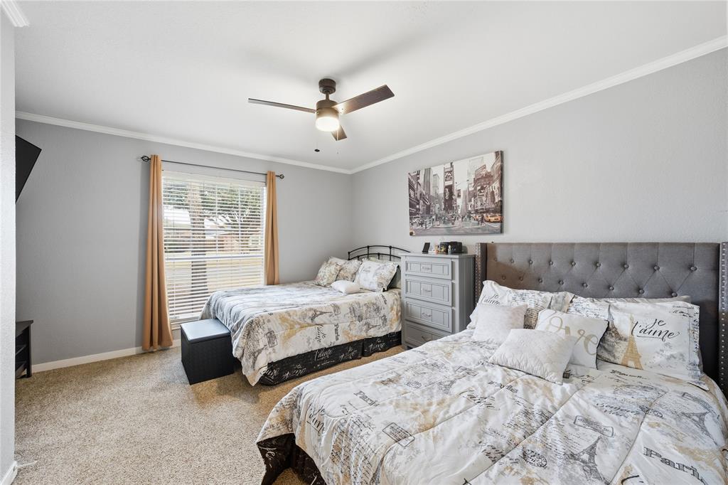 10504 Whitney Trace Drive Waco, TX 76708 - Photo 15 of 24 a bed room with two beds and a window