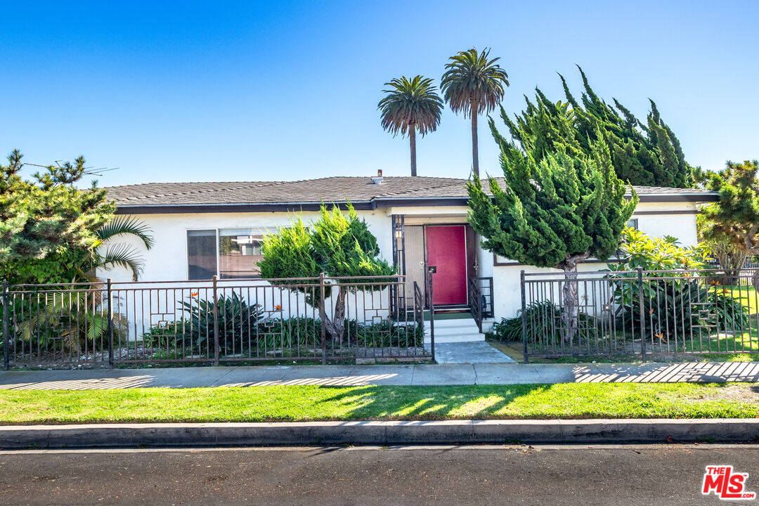 4506 Grand View Boulevard Los Angeles, CA 90066 - Photo 1 of 1 a view of a house with swimming pool and a small yard