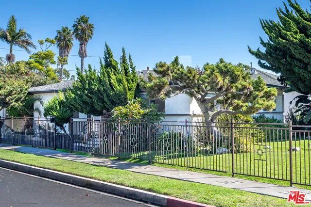 a house view with a garden space