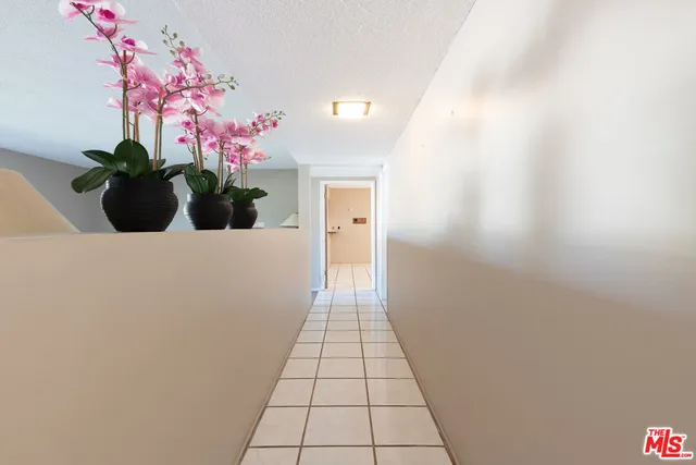 a hallway with a flower pot