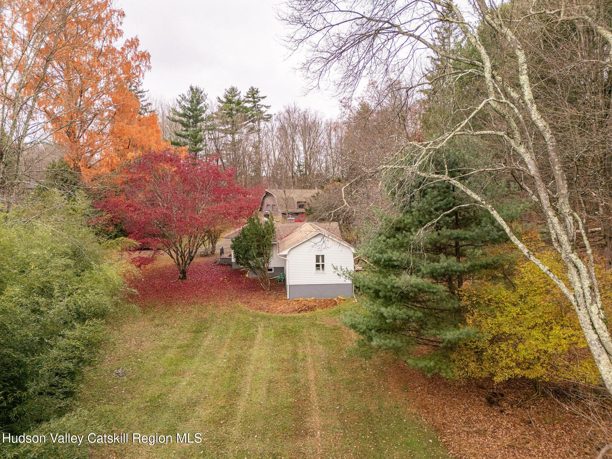 845-849 Peak Road Stone Ridge, NY 12484 - Photo 20 of 50 a aerial view of a house with a yard and large trees