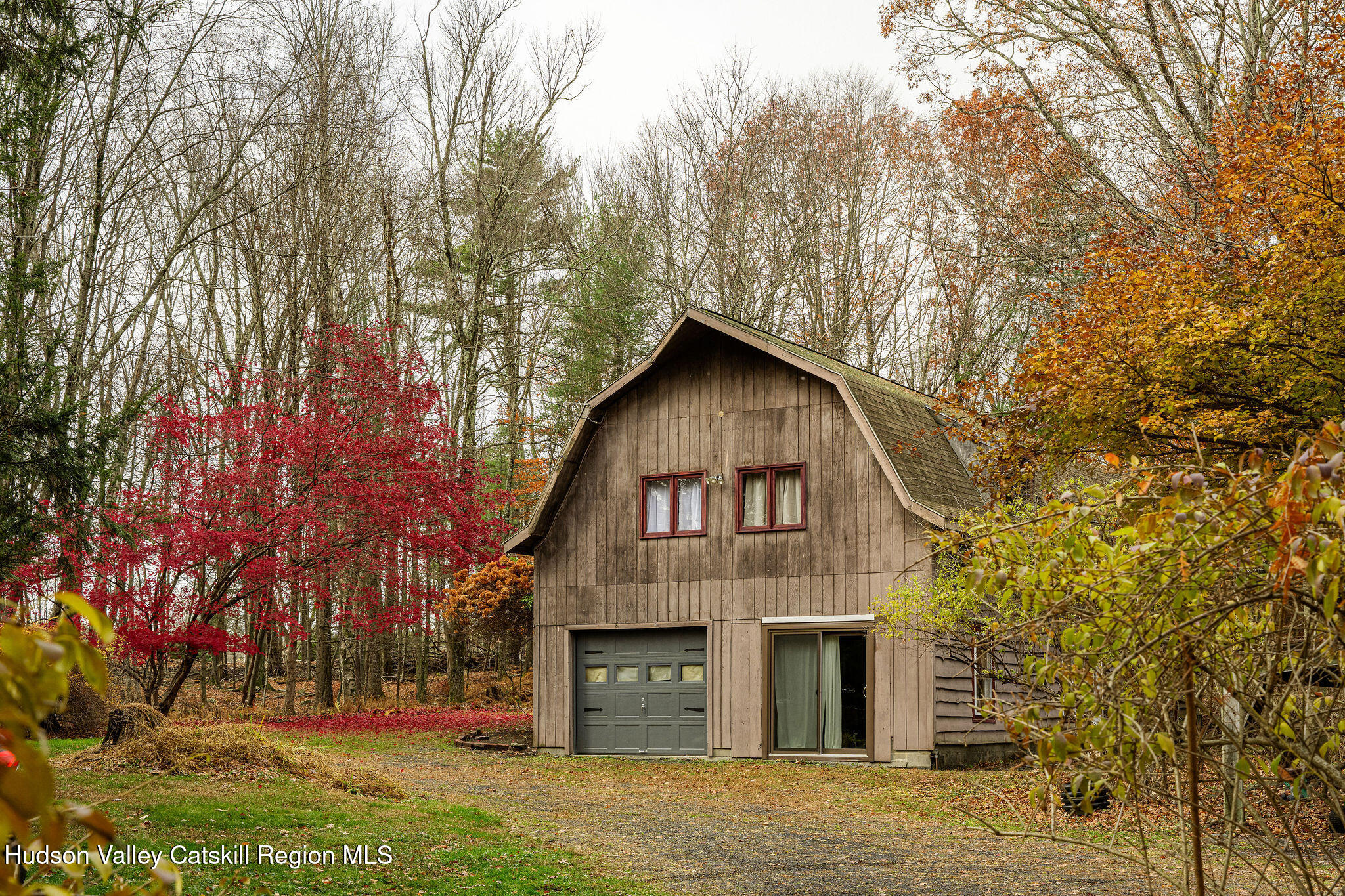 845-849 Peak Road Stone Ridge, NY 12484 - Photo 35 of 50 a front view of a house with a yard and garage