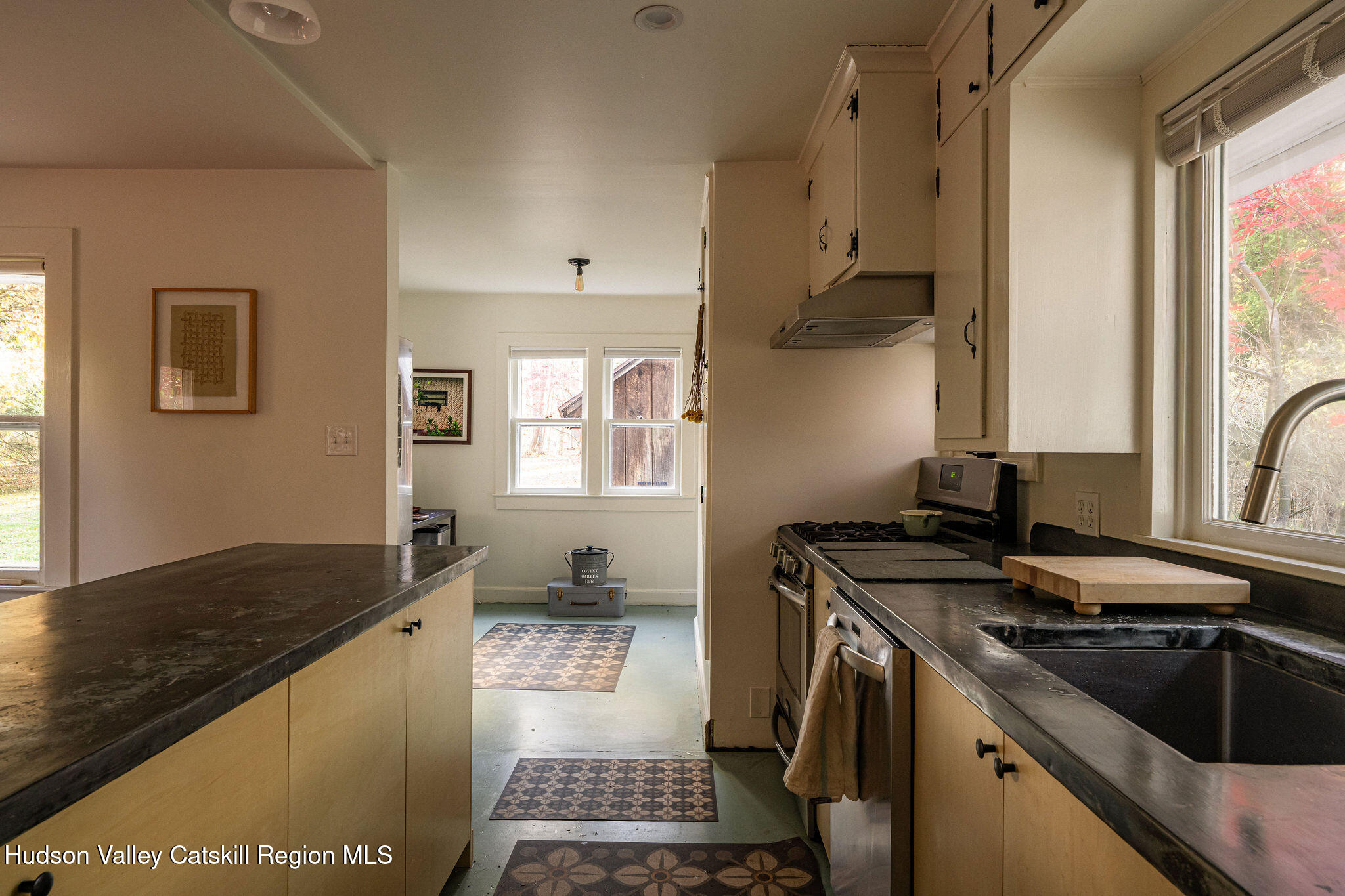 845-849 Peak Road Stone Ridge, NY 12484 - Photo 7 of 50 a kitchen with a sink stove and cabinets