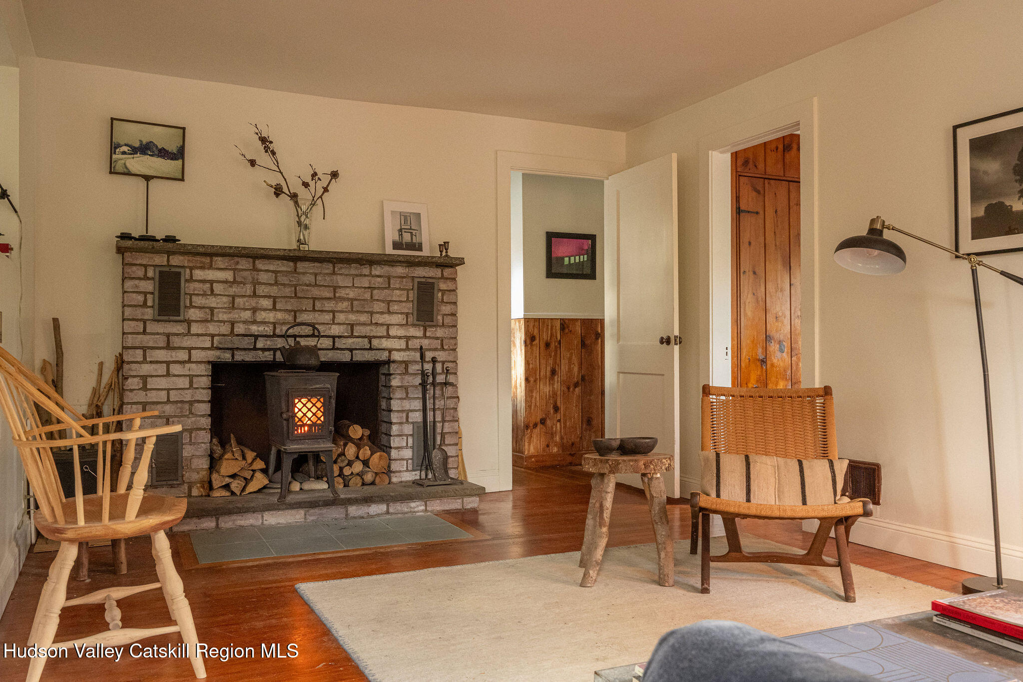 845-849 Peak Road Stone Ridge, NY 12484 - Photo 8 of 50 a living room with furniture a rug and a fireplace