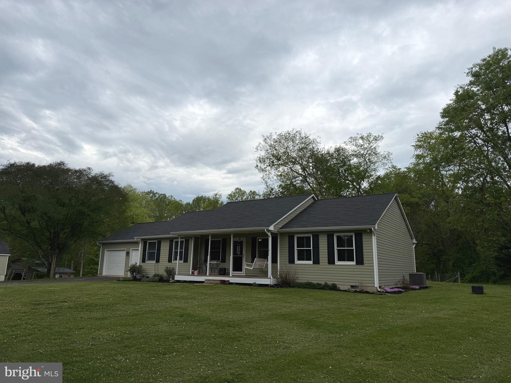 14185 Winks Lane Rixeyville, VA 22737 - Photo 2 of 7 a front view of a house with a garden