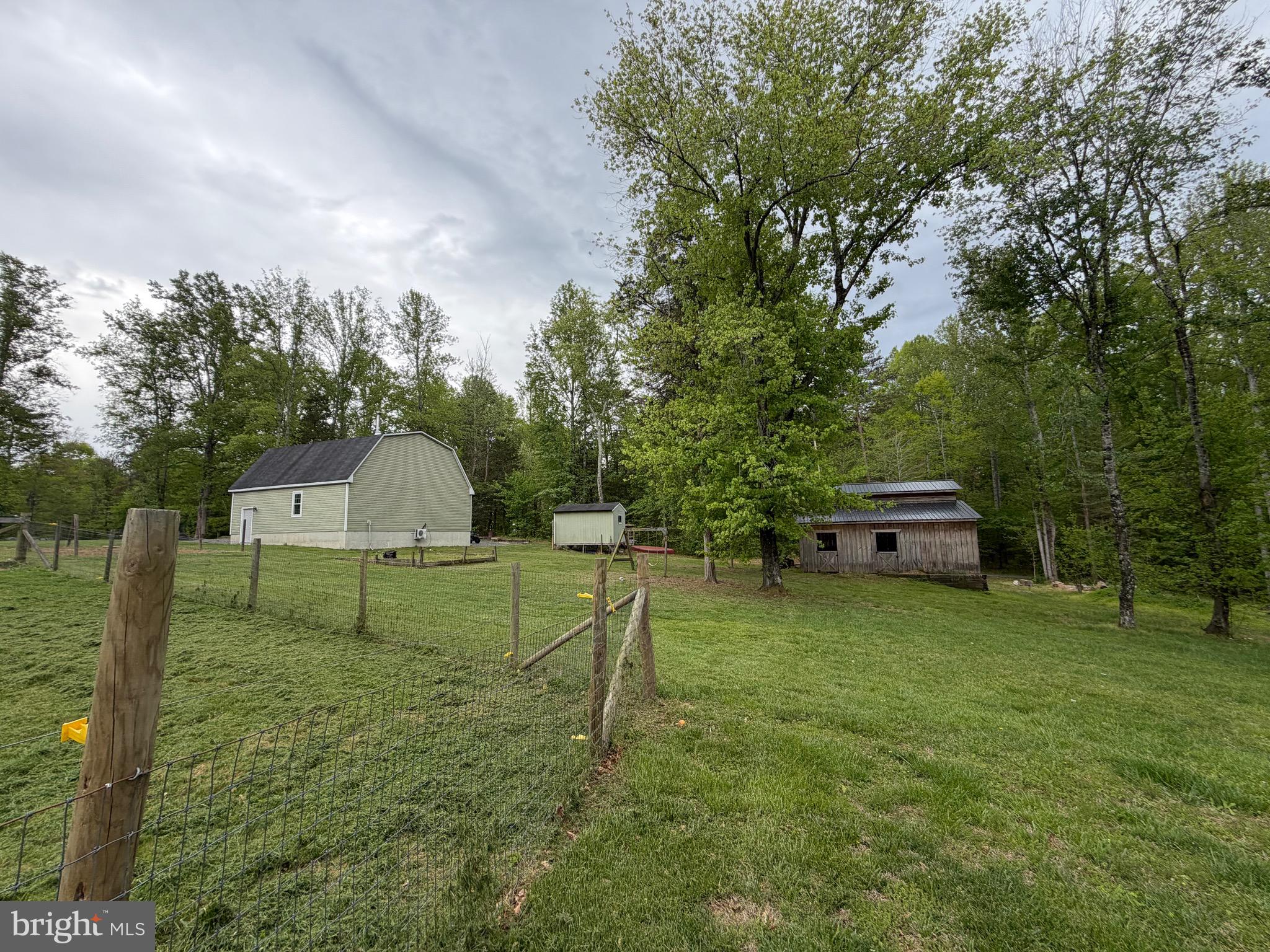 14185 Winks Lane Rixeyville, VA 22737 - Photo 5 of 7 a backyard of a house with table and chairs