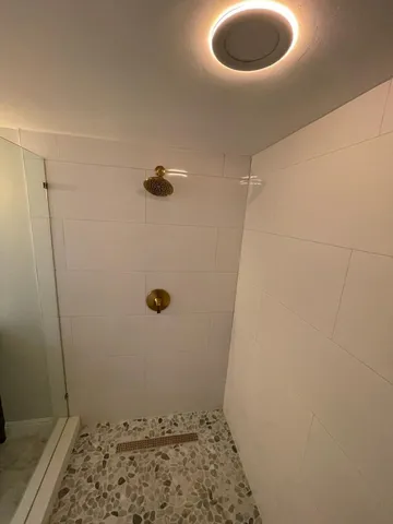 a bathroom with a double vanity sink and a mirror