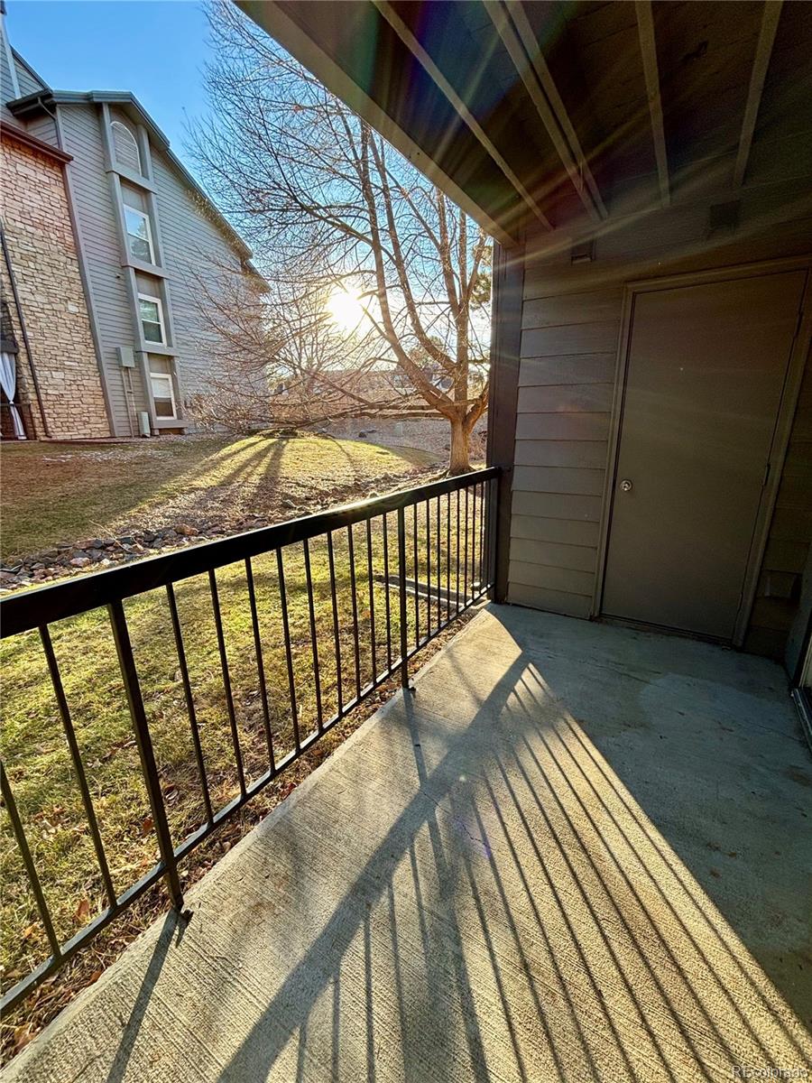 2575 South Syracuse Way, Unit J102 Denver, CO 80231 - Photo 11 of 13 a view of balcony with wooden floor