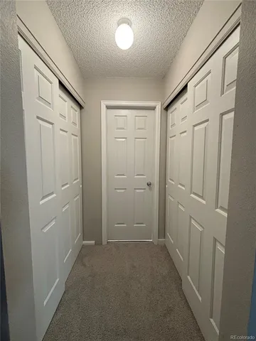 a view of balcony with wooden floor