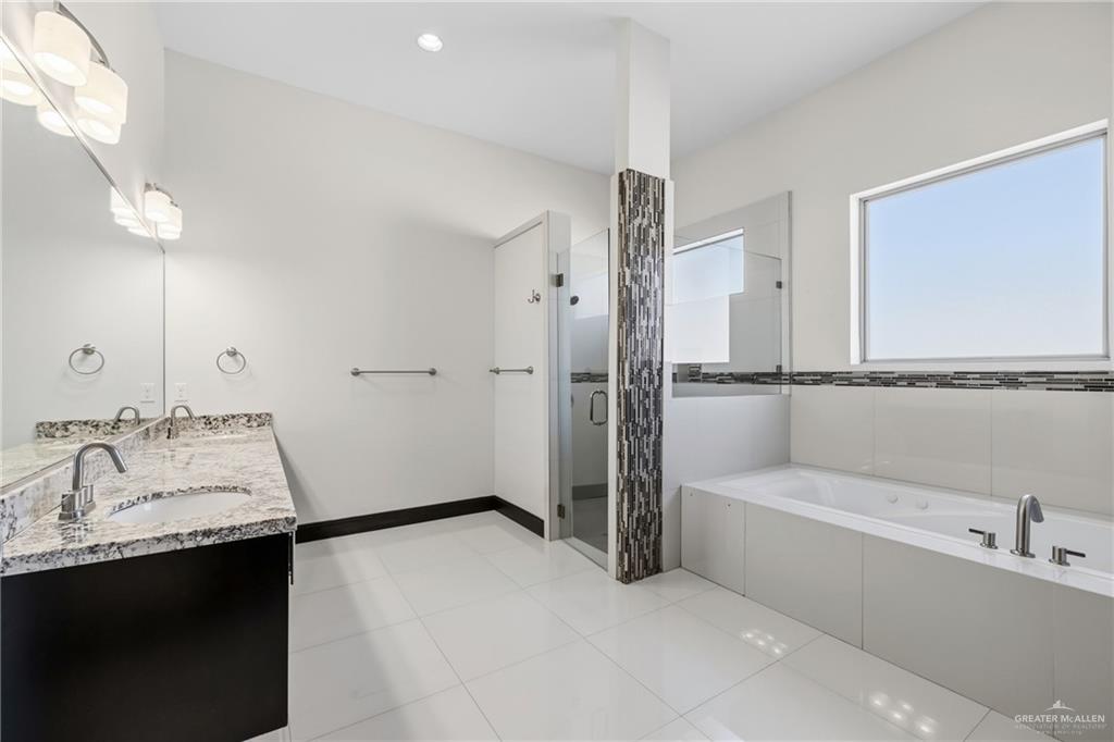 101 East Emory Avenue McAllen, TX 78504 - Photo 11 of 20 a bathroom with a tub sink shower and mirror