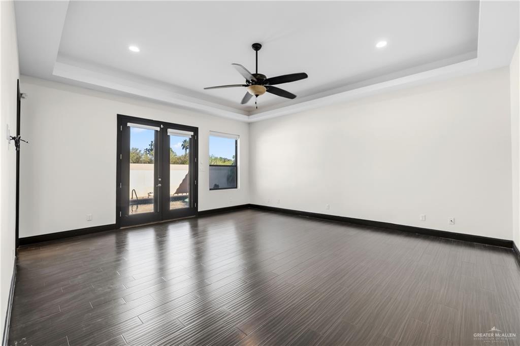 101 East Emory Avenue McAllen, TX 78504 - Photo 12 of 20 a view of a livingroom with wooden floor and a ceiling fan