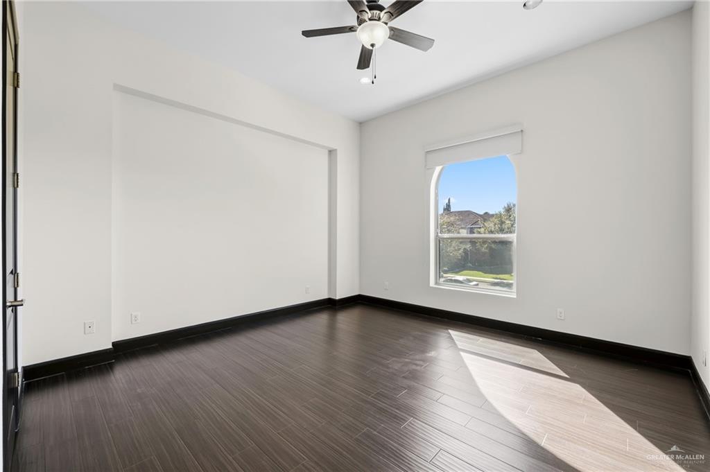 101 East Emory Avenue McAllen, TX 78504 - Photo 15 of 20 a view of an empty room with wooden floor and a window
