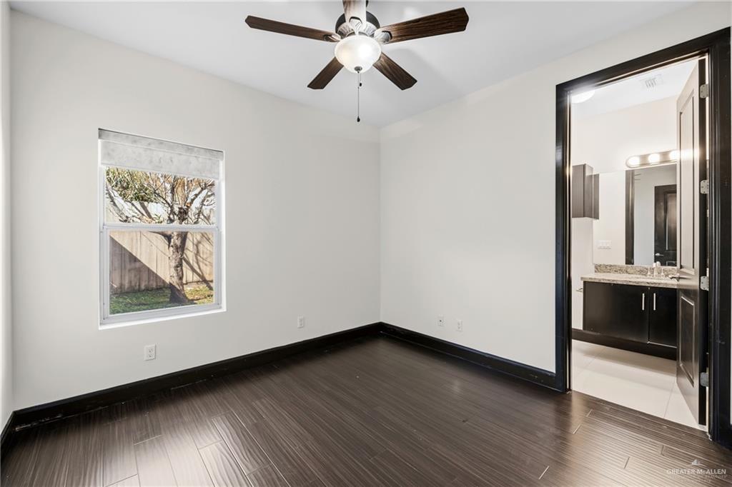 101 East Emory Avenue McAllen, TX 78504 - Photo 9 of 20 a view of an empty room with wooden floor and a window