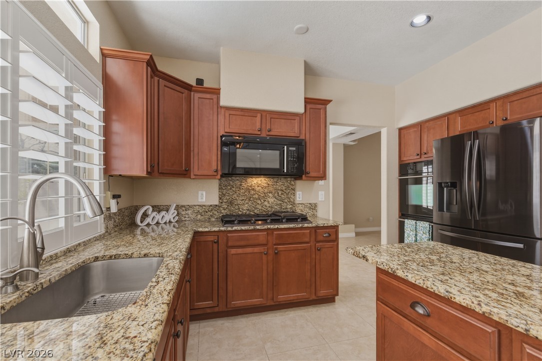 29 Olive Tree Henderson, NV 89074 - Photo 16 of 60 This bright kitchen features ample counter space and modern appliances, perfect for everyday living.