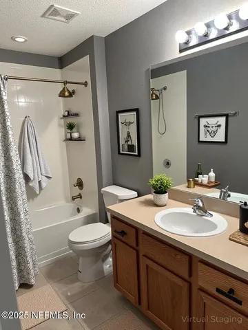 a bathroom with a sink toilet and a mirror
